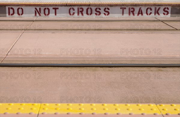 Warning text on platform