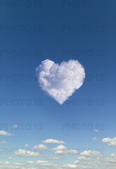 Heart shaped clouds against blue sky