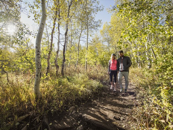 Couple walking in forest