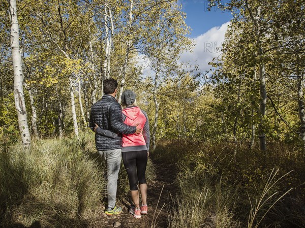 Rear view of couple in forest