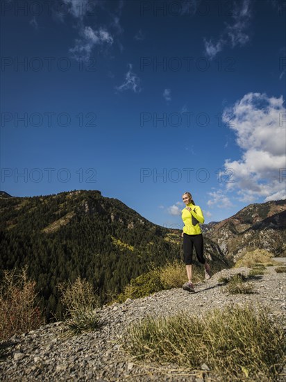 Woman jogging in mountain landscape