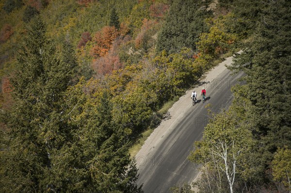 Aerial view of man and woman riding bicycles on country road