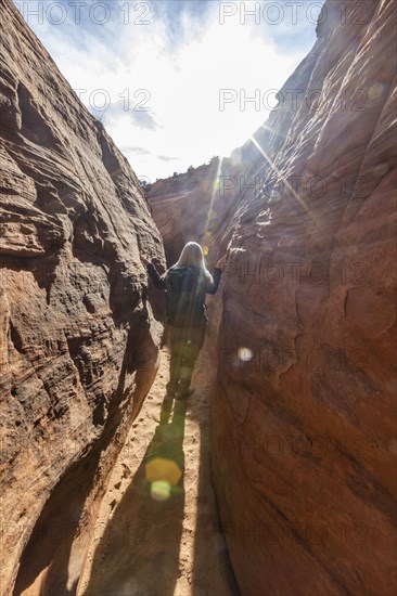 Senior hiker exploring slot canyon