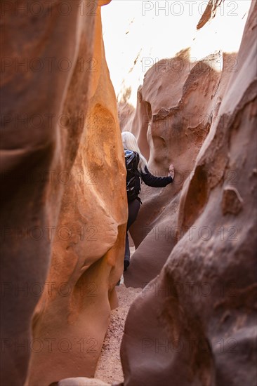 Senior hiker exploring slot canyon