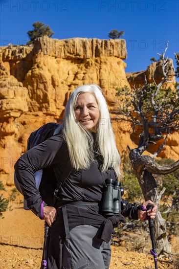 Portrait of senior hiker in rocky landscape