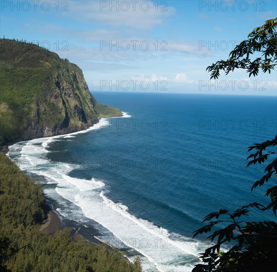 Black sand beach with cliffs