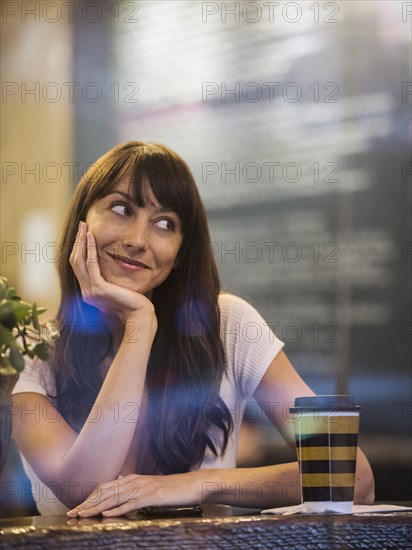 Smiling woman sitting in cafe
