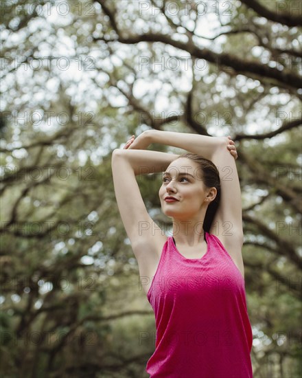 Woman stretching in park