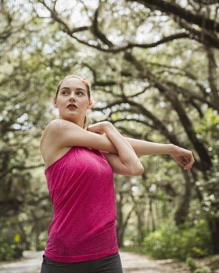 Woman stretching in park