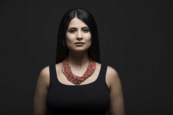 Studio portrait of elegant woman