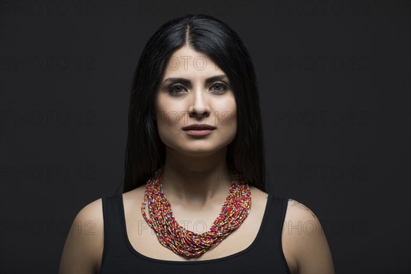 Studio portrait of elegant woman