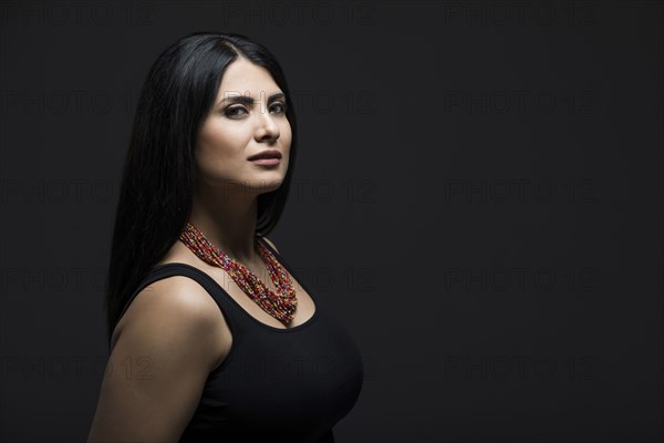 Studio portrait of elegant woman