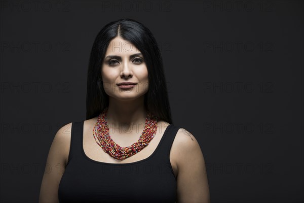 Studio portrait of elegant woman