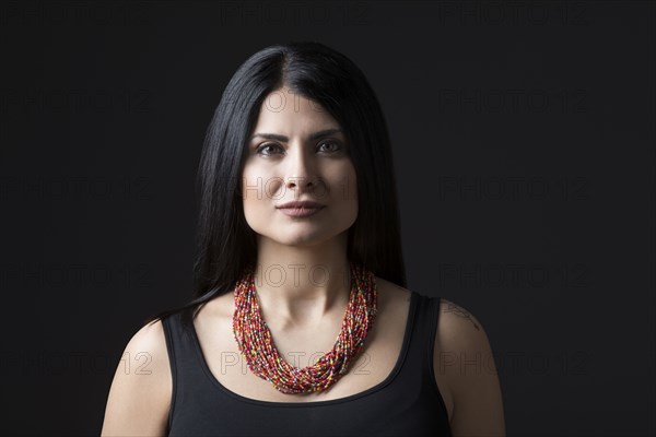 Studio portrait of elegant woman