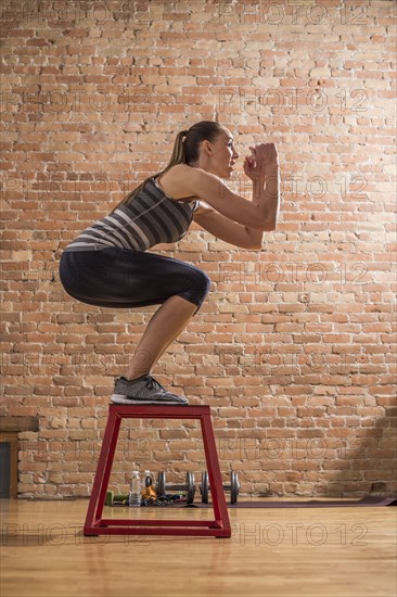 Woman exercising in gym