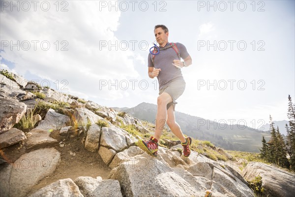 Mature man jogging in mountains