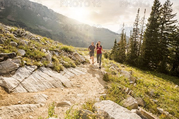 Couple jogging in mountains