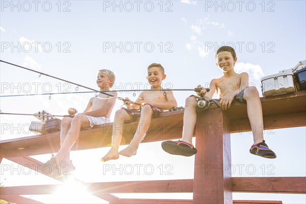 Low angle view of shirtless boys