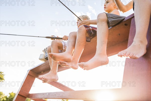 Low angle view of three boys