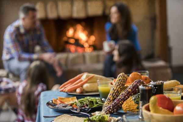 Dinner on table and family with children