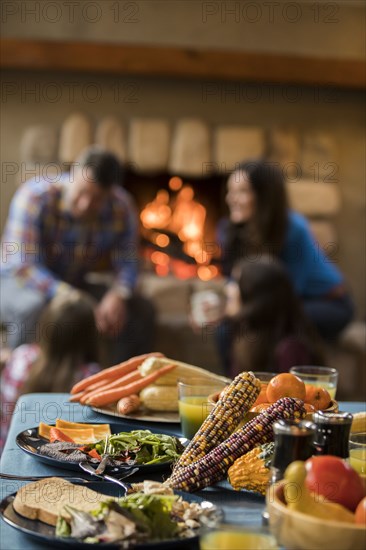 Dinner on table and family with children