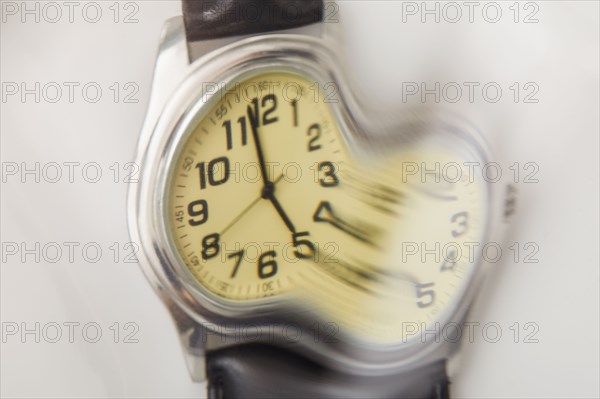 Close-up of distorted wristwatch