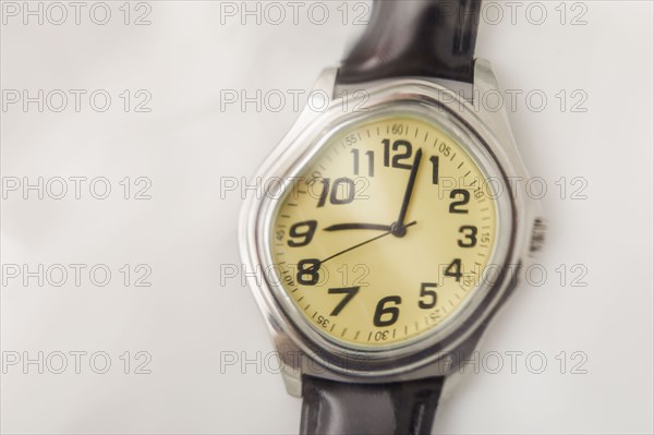 Close-up of distorted wristwatch