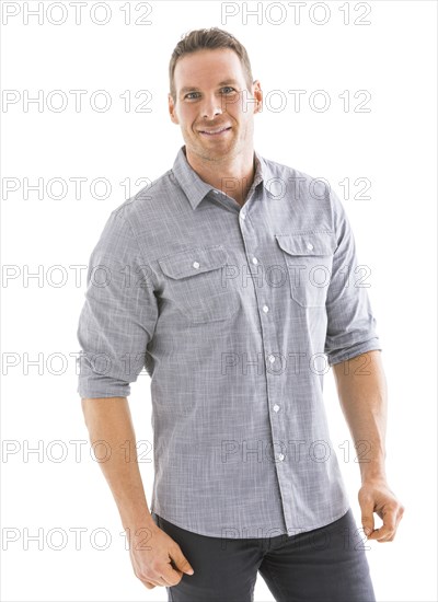 Studio portrait of smiling man