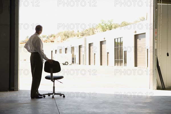 Businessman in warehouse