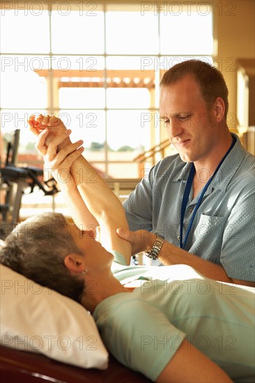 Physical therapist working with patient