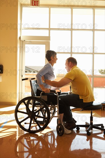 Physical therapist working with patient