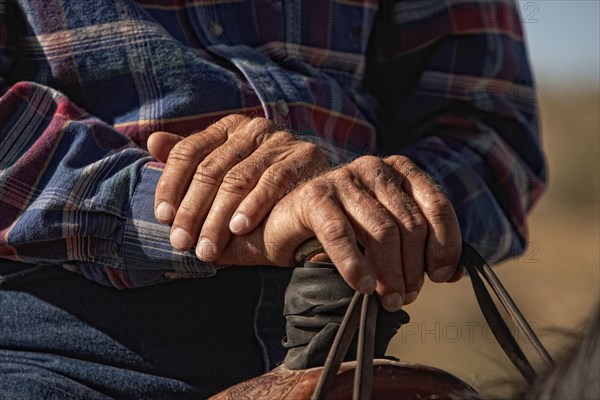 Close-up of cowboys hands