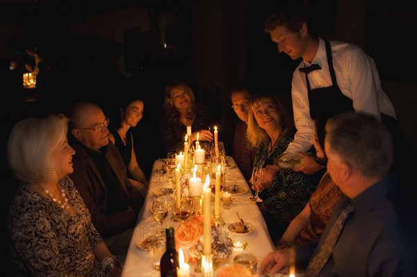 Group of friends celebrating in restaurant