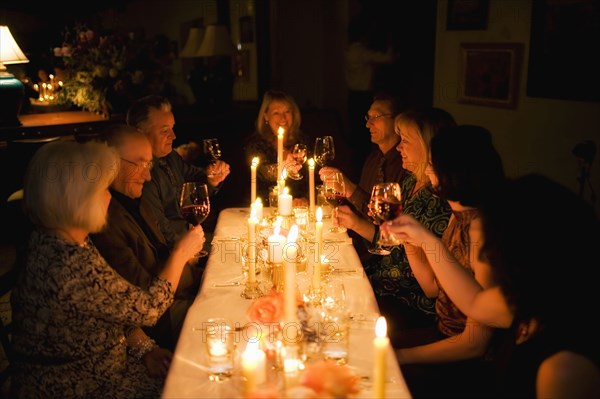 Group of friends celebrating in restaurant