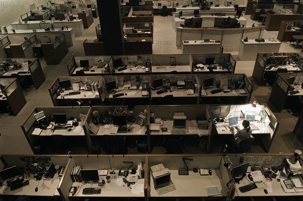 Woman working late at night in office