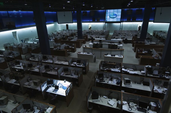 Illuminated desk in dark office