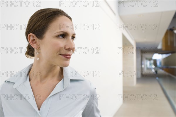 Businesswoman in office hallway