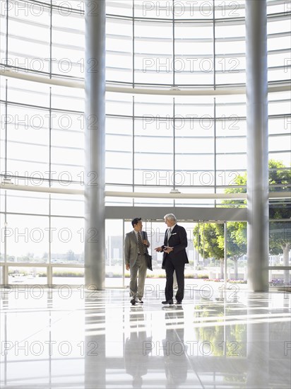 Two businessmen in lobby