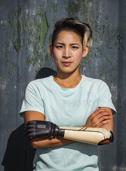 Portrait of athletic woman with prosthetic arm