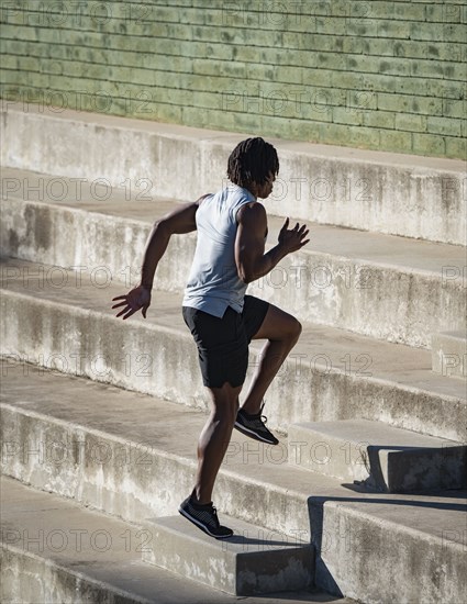 Man jogging up steps