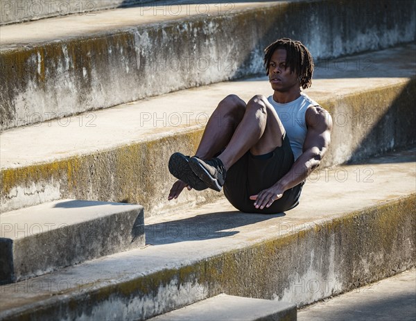 Man exercising on steps