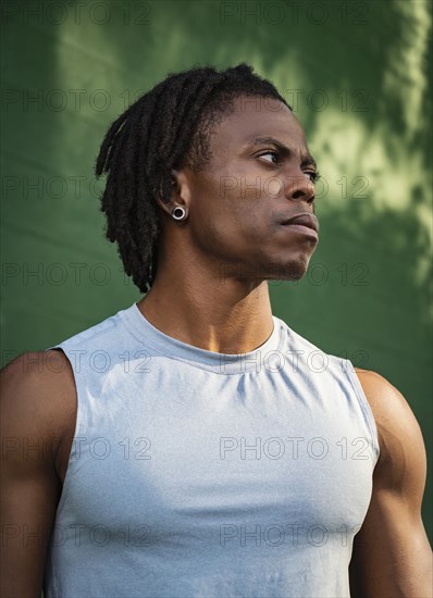 Portrait of serious athlete man outdoors