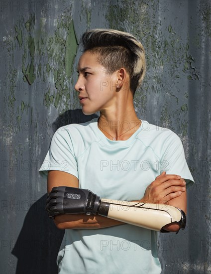 Portrait of athlete woman with prosthetic arm