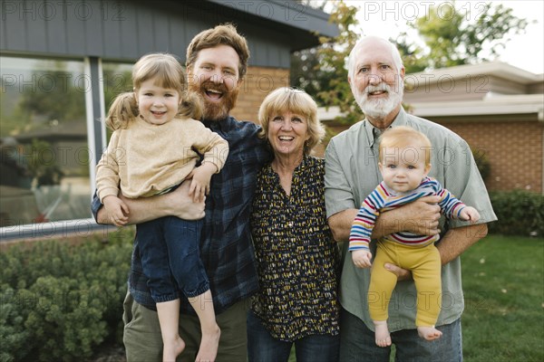 Portrait of smiling three generation family with children