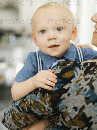 Close-up of mother holding baby son