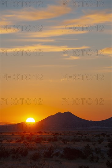 Sun setting over hills in Cerrillos Hills State Park