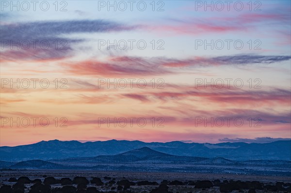 Sun setting over hills in Cerrillos Hills State Park