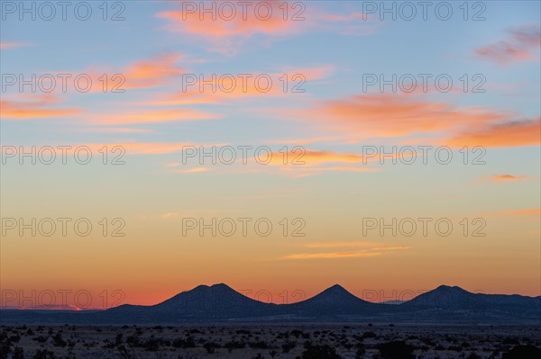 Sun setting over hills in Cerrillos Hills State Park