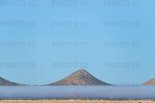 Fog above desert landscape in Cerrillos Hills State Park