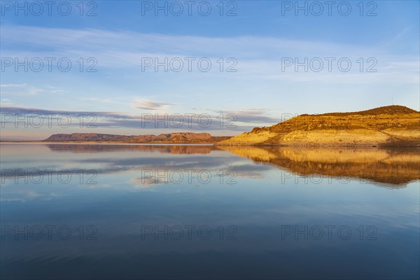 Rock formations reflected in water in Elephant Butte Lake State Park